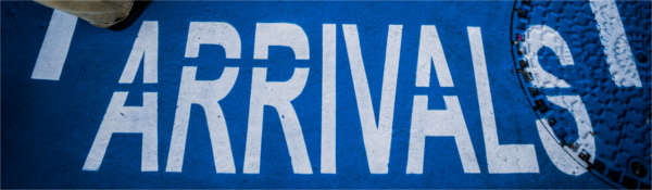 Image of a floor mat marked "arrivals"