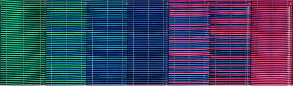 Cropped image of multicoloured woven fabric in blue and purple hues